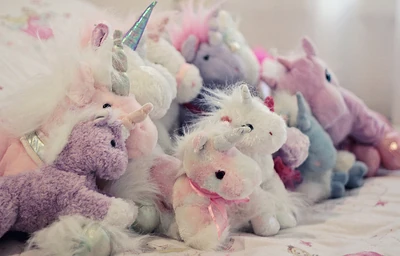 A large pile of plush toy unicorns.