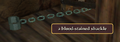 A blood-stained shackle.png