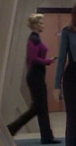 Female command division officer in corridor, 2369