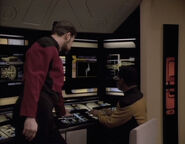 Riker and La Forge look at the probe