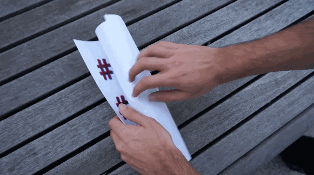 riottech: drone sticking a flyer to a window
