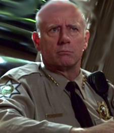 Datei:Xander Berkeley as Sheriff Thomas McAllister.png