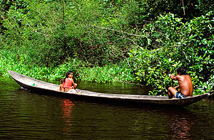 A Warao family in their canoe.jpg
