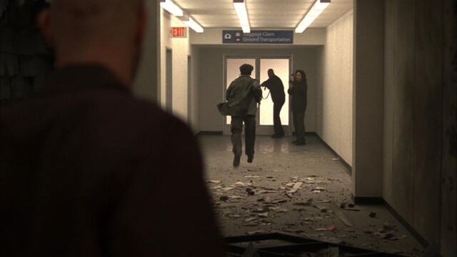 File:5x04-terrorists-down-hallway.jpg
