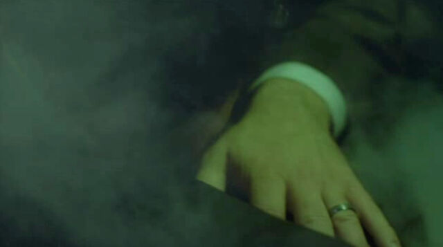 File:24- S8, Ep22- Logan's limo driver KO'ed by gas grenade.jpg