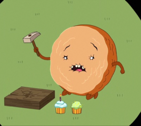 File:S2e23 Cinnamon Bun hammering block of wood.png
