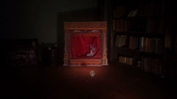 A glass marble rolling into the diorama