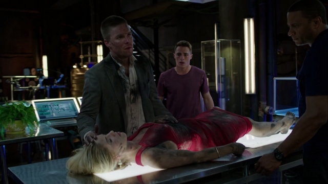 File:Oliver brings Felicity to the Arrowcave after Werner Zytle's attack.png