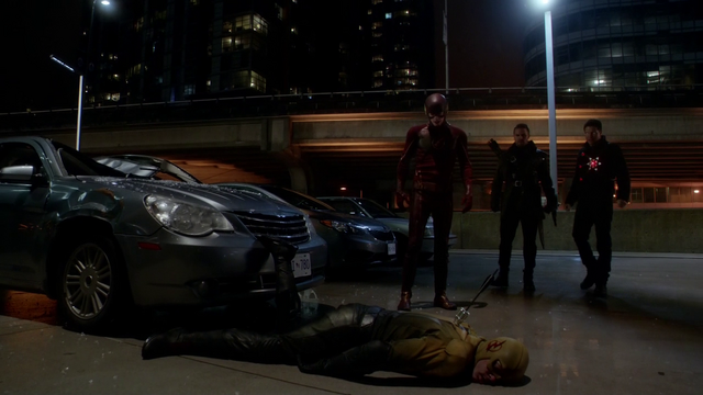 File:The Flash, Firestorm, and The Arrow stand over a defeated Reverse-Flash.png