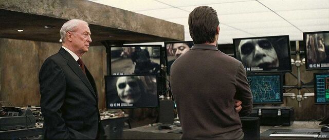 File:TDKAlfredandBrucelookingatJokerVideo.jpg