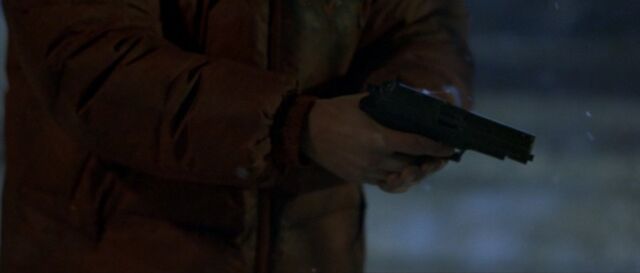 File:Bourne disassembling the SIG.jpg