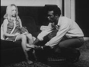Ben giving Barbra slippers in Night of the Living Dead bw