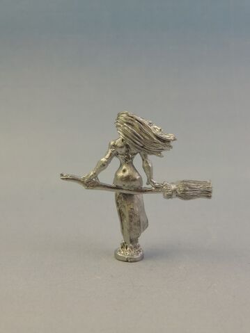 File:WF UND011 Witch sitting on broom - rear.jpg