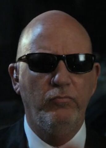 File:S02E06-Man in suit.jpg