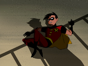 Robin ensnared by the Joker