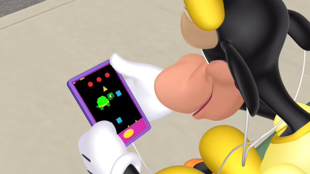 File:Clarabelle playing her game.jpg