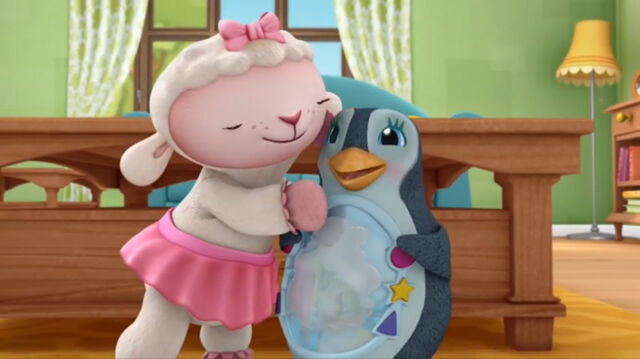 File:Lambie cuddling waddly penguin.jpg