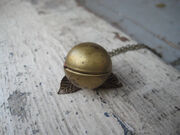 Golden snitch necklace