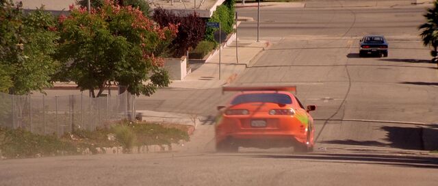 File:Supra chasing Charger.jpg