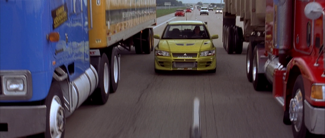 File:EVO between two trucks.png
