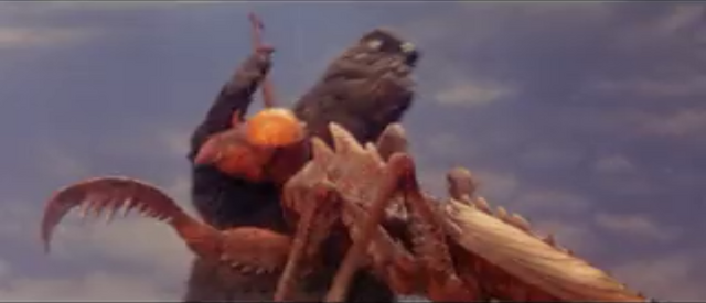 File:All Monsters Attack - Kamacuras number 2 fails his attack against Godzilla.png