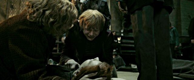 File:DH2 The Weasleys beside dead body of Fred.jpg