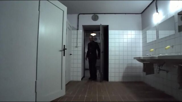 File:Schenck entering restroom.jpg