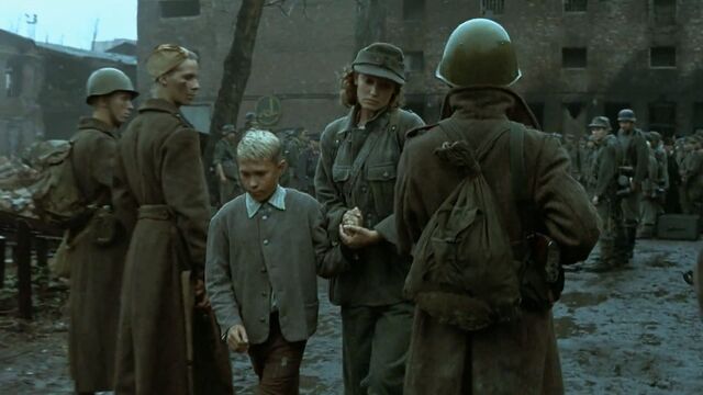 File:Traudl and Peter walk past Soviets.jpg