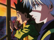 Gon and Killua amazed at the beautiful sight from their room