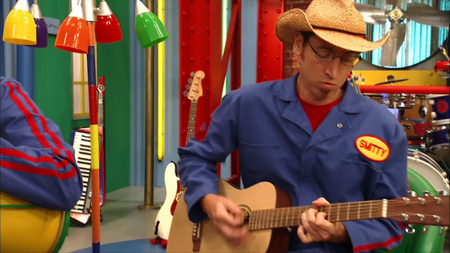 File:S3e24 Smitty playing instrument.png