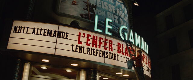 File:Shosanna on the ladder with the Piz Palu film letters.jpg