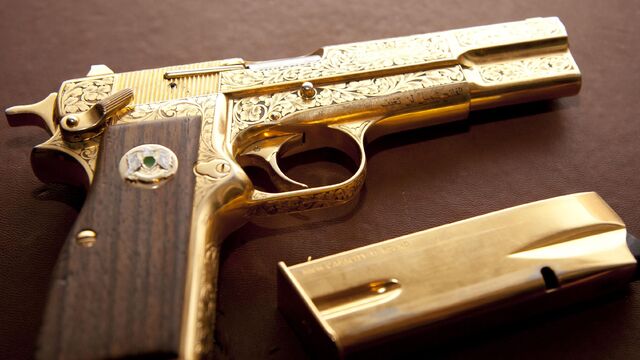 File:Gaddafi golden gun.jpg