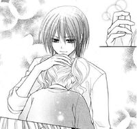 Misaki pats Sakura on the head