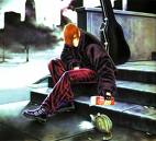 Iori alimentando a su gatito.jpg