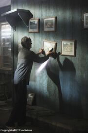 5x09 Christian in Processing center.jpg