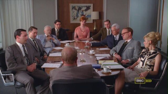 File:Blowing smoke meeting.jpg