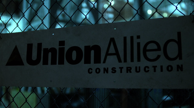 File:Into the Ring Union Allied Construction sign.png