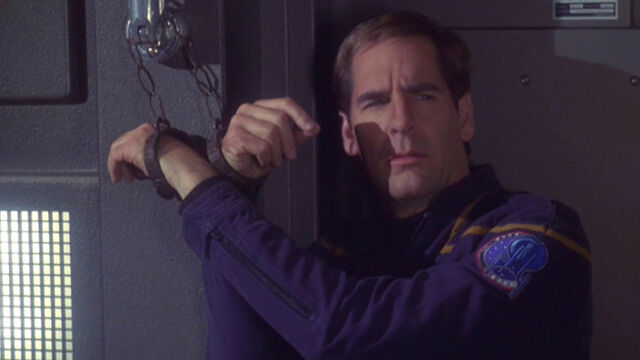 File:Archer shackled to the wall.jpg