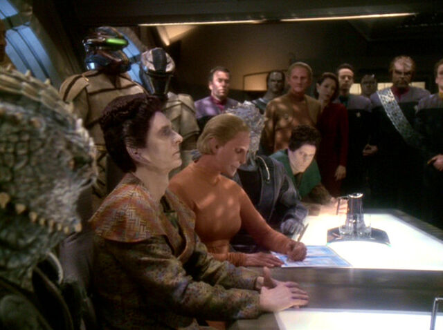 File:Female Changeling signs Treaty of Bajor.jpg