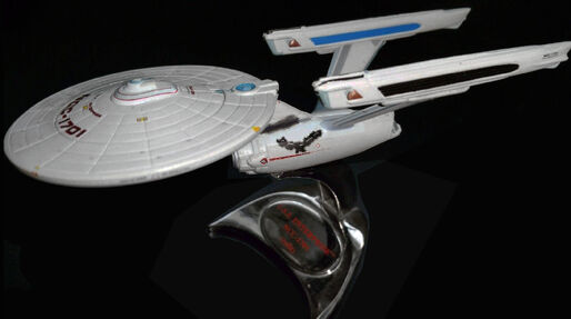 File:JL S2 Battle Damaged USS Enterprise (refit).jpg