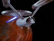 USS Enterprise fires on planet.jpg
