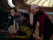 Picard Wesley and La Forge looking at LCARS display