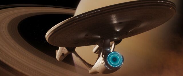 File:USS Enterprise (alternate reality) hides in Saturn's rings.jpg