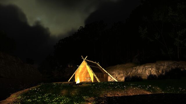File:Campfire by a lonely hut.jpg