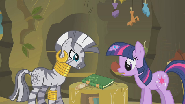 File:Twilight looks at the book that contains the remedy S1E09.png