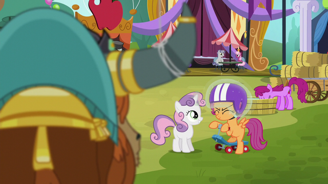 File:Sweetie Belle levitating helmet on Scootaloo's head S5E11.png