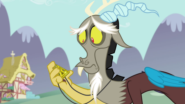 File:Discord looking at the medallion S4E26.png