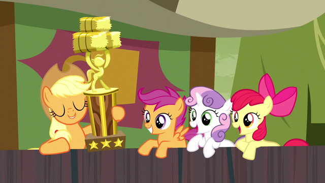 File:Applejack appears with hay stacking trophy S5E6.png