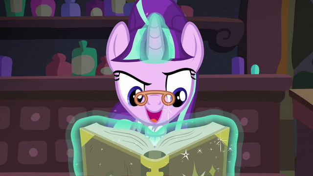 File:Snowfall looks at her book S06E08.png