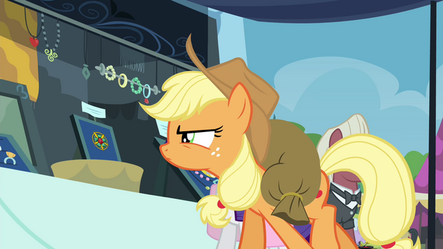 File:Applejack looking closely at brooch S4E22.png
